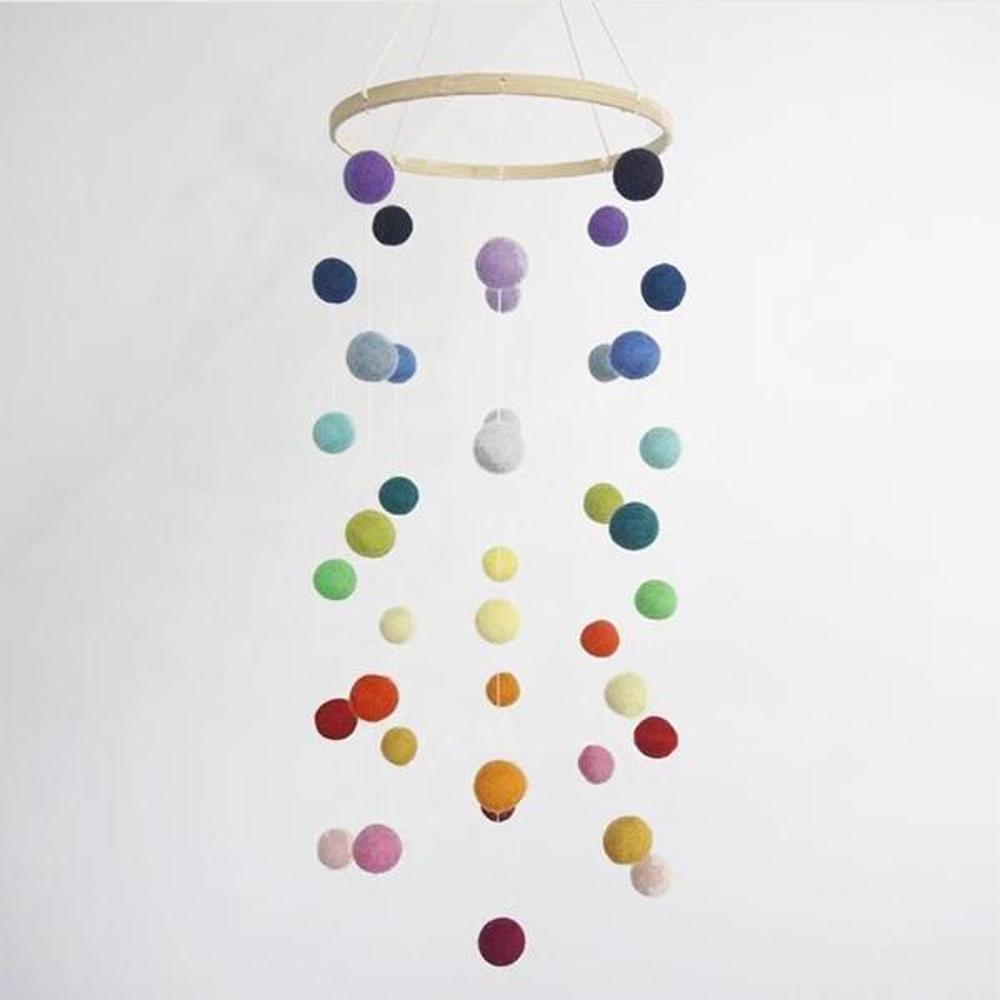 Decorative mobile with colored pom-poms