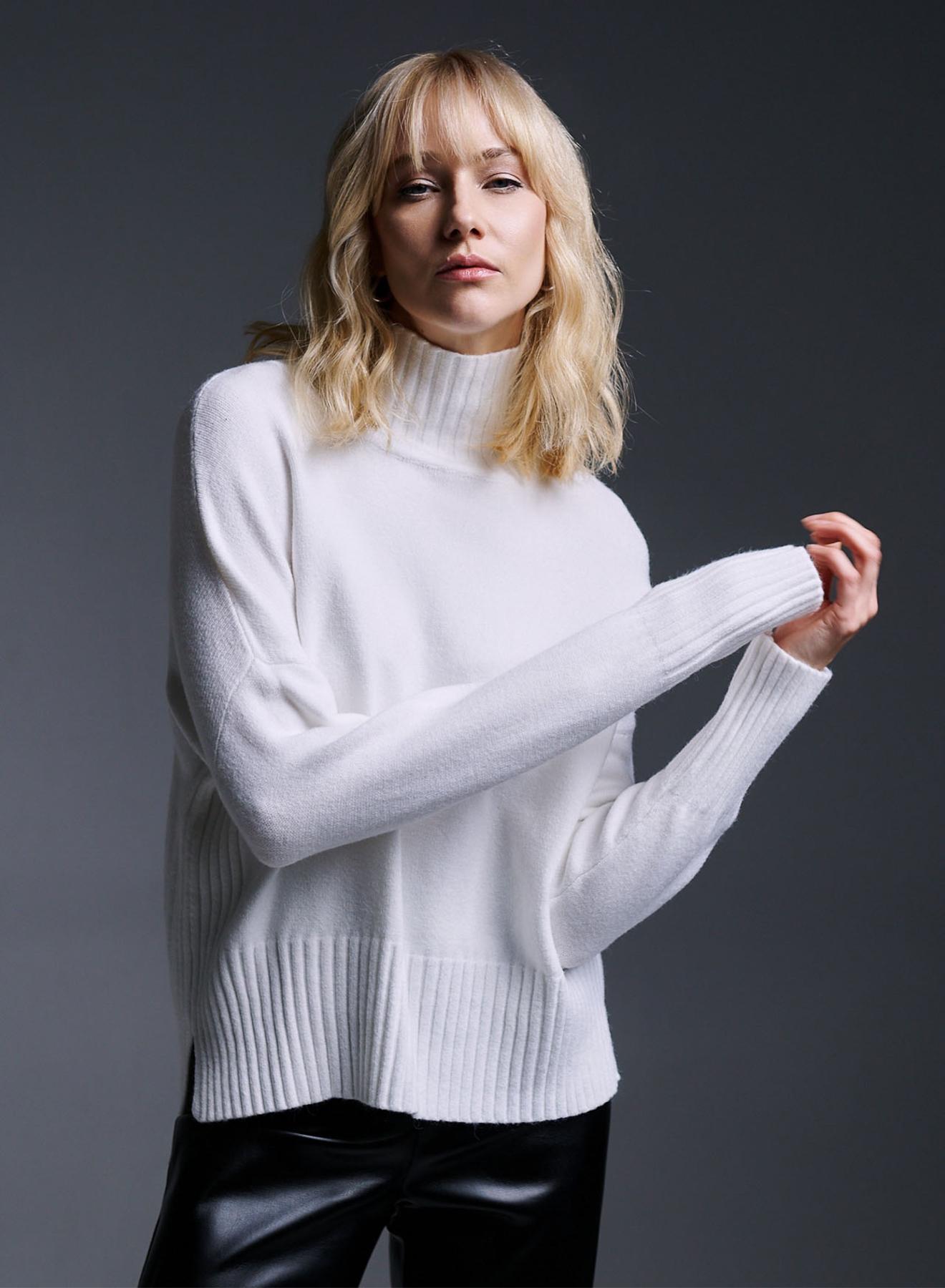 Knitted turtleneck top with side vents and rib details - 1