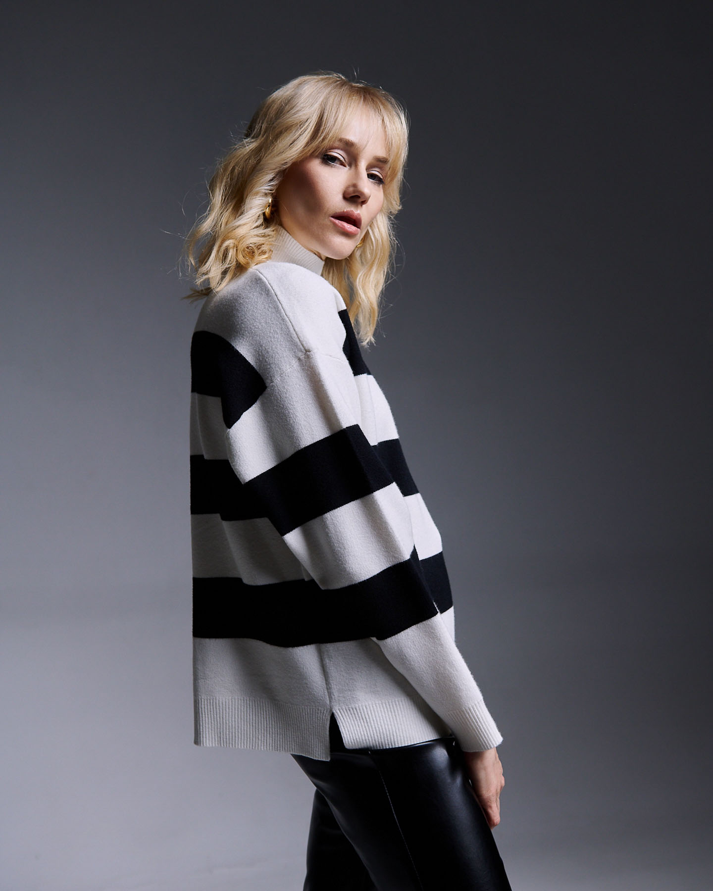 Half-turtleneck knit blouse with wide stripes and side buttons - 1